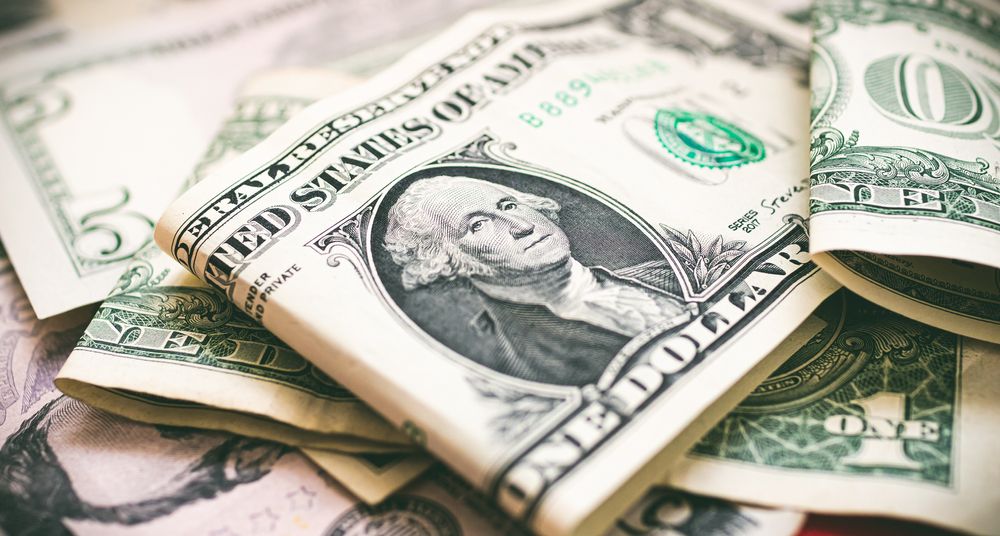 Money, US dollar bills background. Money scattered on the desk. 